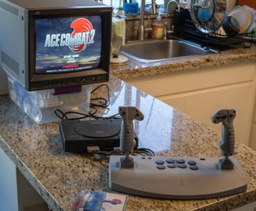 Three of the coolest items in my gaming collection: a JVC professional CRT monitor, a “Net Yaroze” PlayStation, and the Sony PlayStation Analog Joystick