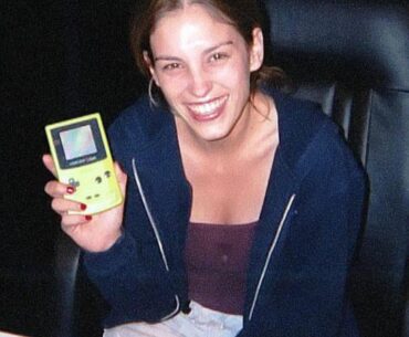 A pic of Amy Jo Johnson (the Pink Ranger from Mighty Morphin Power Rangers) holding a Game Boy Color