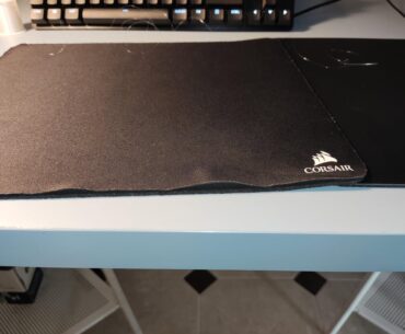 My mousepad started tearing around the edges, so I sewed it up instead of buying a new one