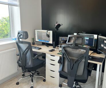 What can I do to make this overall better…? Need a dual setup for both my partner & I WFH. Feel like I need something on the black wall.