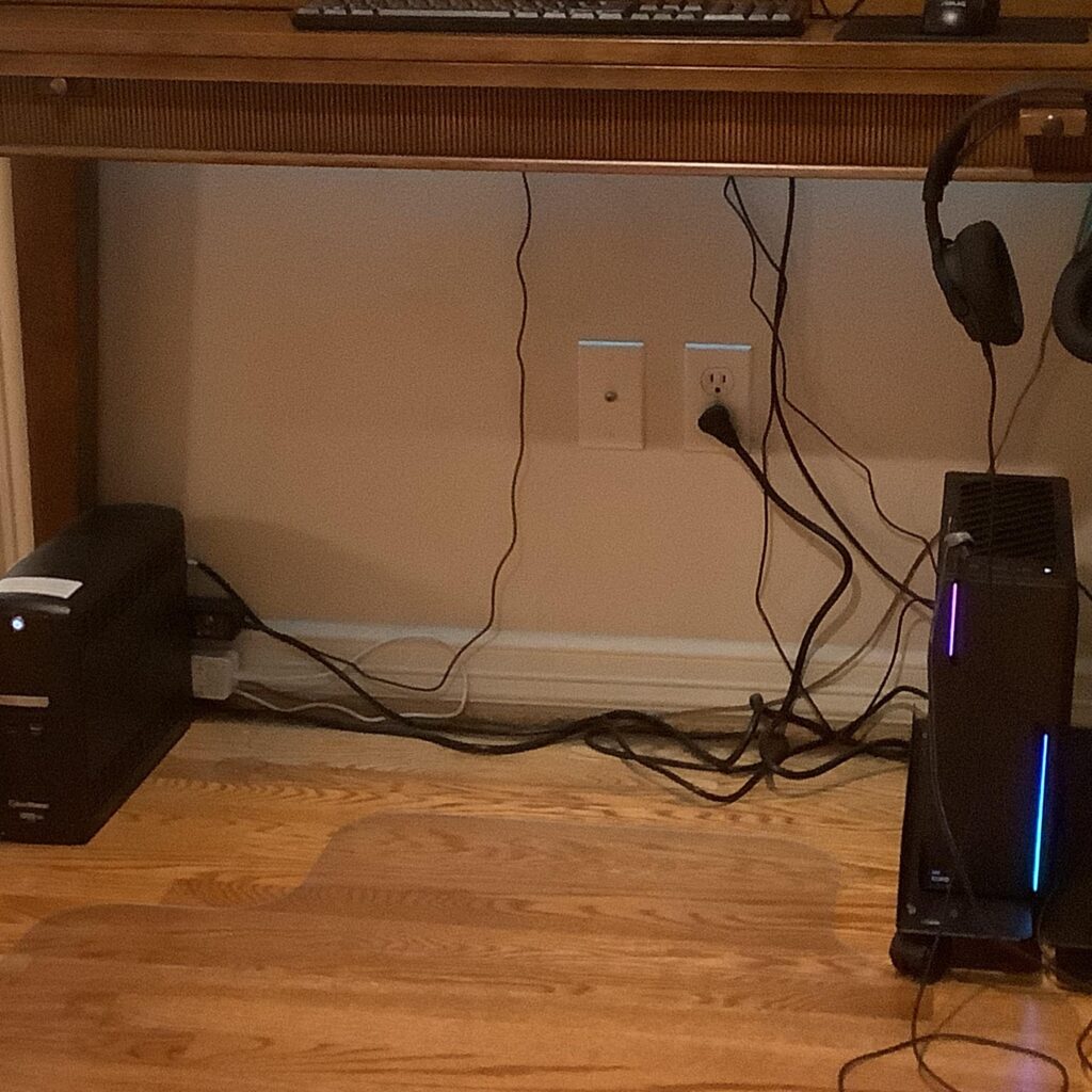 What is best way to manage cables?  Tucked under desk?