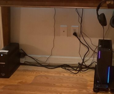 What is best way to manage cables?  Tucked under desk?