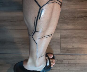Arasaka Cyberware calf tattoo