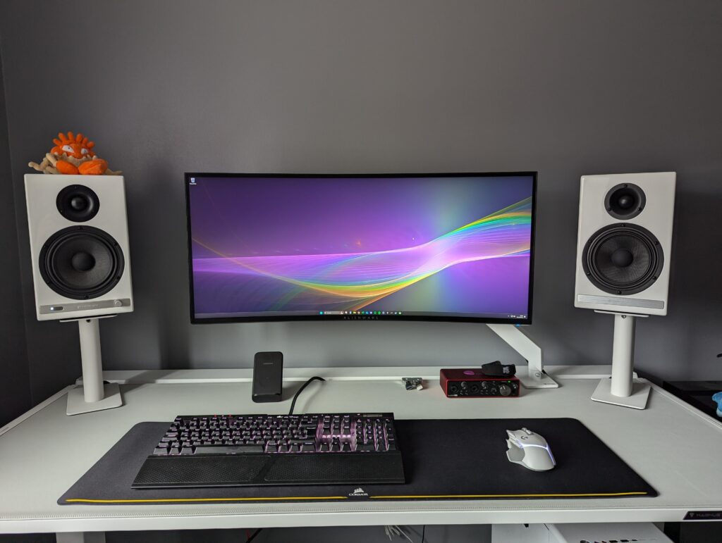 Black and white gaming/guitar playing setup. Need to get something on the walls.