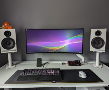 Black and white gaming/guitar playing setup. Need to get something on the walls.
