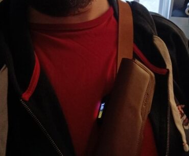 I don't like wearing wristwatches, so I added a tiny smartwatch to my messenger bag's strap and it feels oddly cyberpunkish