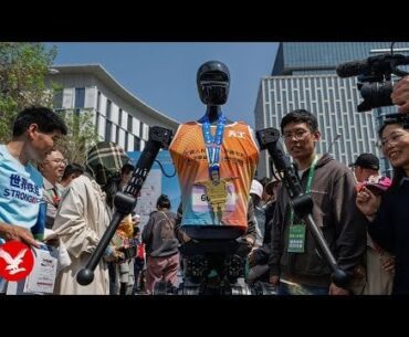 Robots compete against humans for first time in half marathon