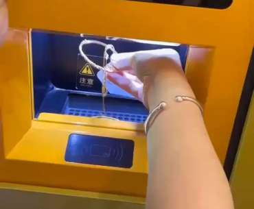Chinese machine melts and converts gold into an instant bank transfer for its value.