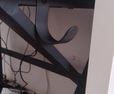 Does anyone know what this part on my desk is? I have had my desk for 4 years and this has been here the entire time and I still don't know what it does