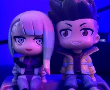 David and Lucy sitting on the moon together