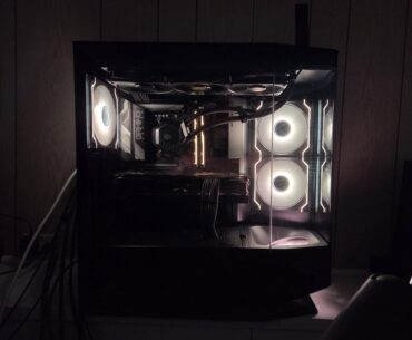 Just moved my pc into a new case. Cougar FV270. Gotta say, this case is pretty underrated and looks a little different because of that angled fan.