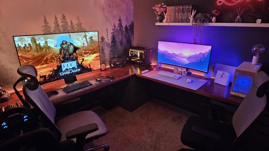Made the most out of a small office space. Sim racing setup and his and her PC's.