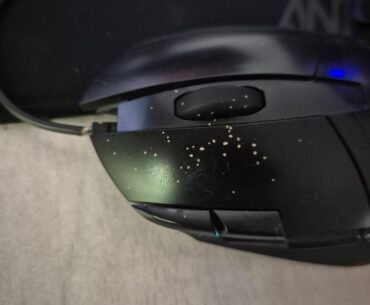 What are these spots that appear on my mouse overnight? they are hard and bumpy in texture and can be scraped off. they weren't there yesterday evening, but they are here today morning