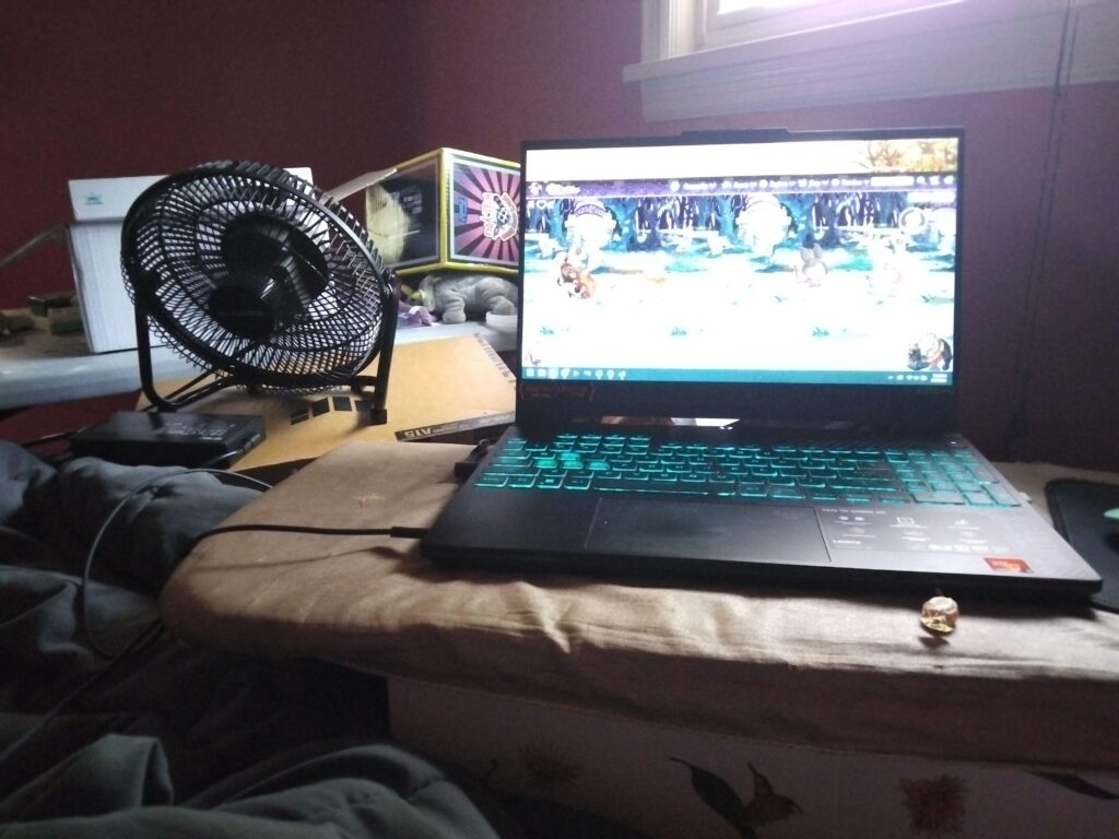 my gear might not be that jank but my set up certainly is. A falling apart ironing board on an old box and a fan cooling the laptop charger. In my bed. Been doing this since I moved into my new situation lmao.