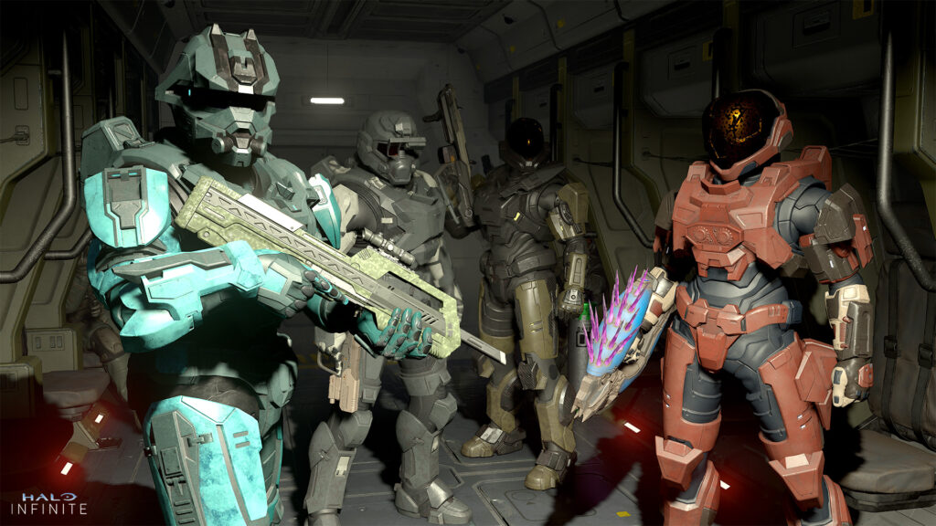Four Spartans stand in the staging area of a Pelican transport shuttle. They wear the SECOPS, EVA GEN1, Raider, and Scarred Comet armor sets.