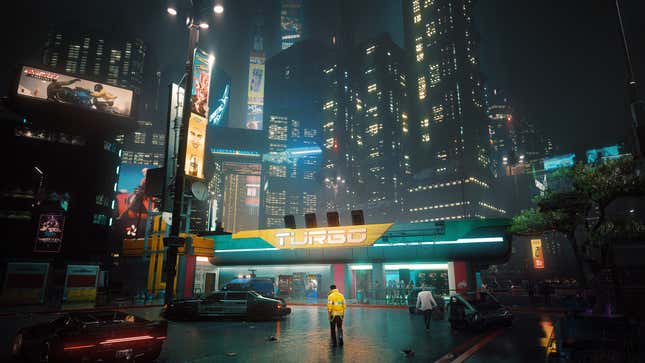 A gas station is dwarfed by the size of Night City as it looms overhead.