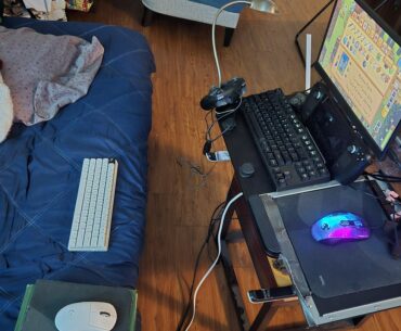 Alt setup away from my main desk. I use the white peripheral for FPS games on Steam.