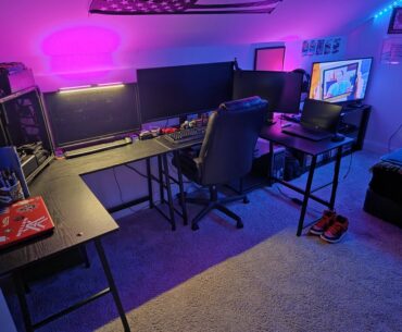 I've seen a few 3 monitor setups here so I figured i'd share mine.