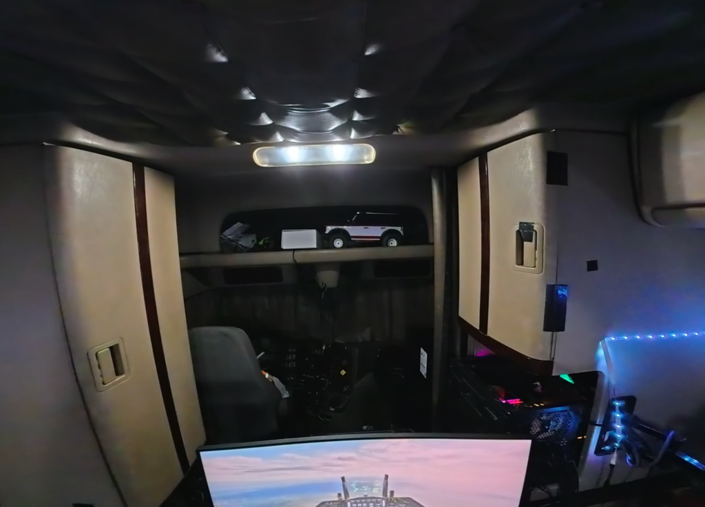 A few years ago I shared my gaming rig inside my “Big Rig” and it got a lot of reactions. That same rig is still kicking today, just in a different truck now! Even added head tracking recently! I also have a steering wheel and yes, occasionally play Truck Simulators. But I usually stick to the skies