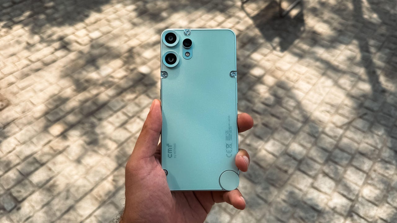 A person holding the CMF Phone 2 Pro.