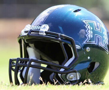 Black U H football helmet