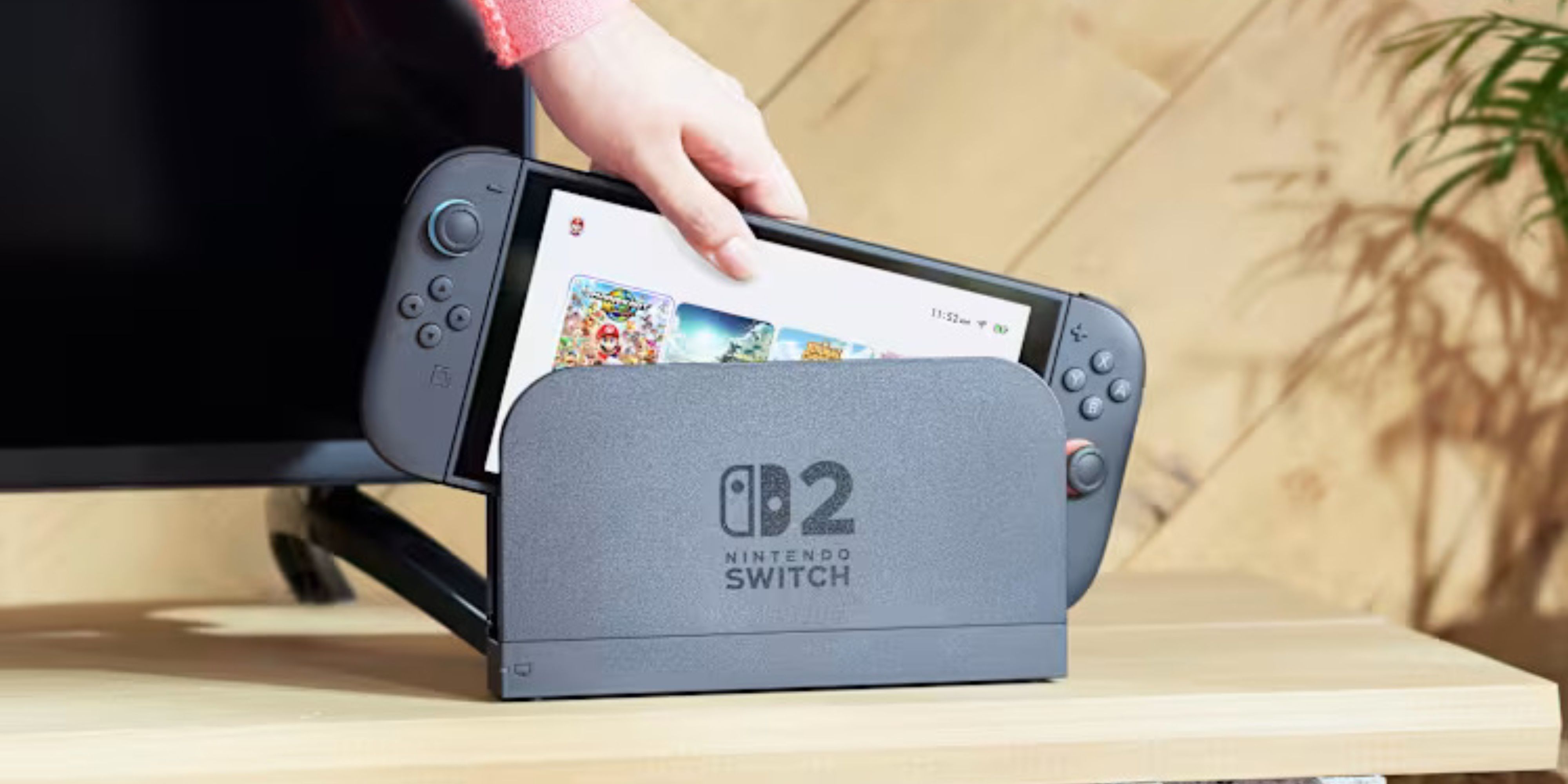 someone taking a switch 2 out of its dock.