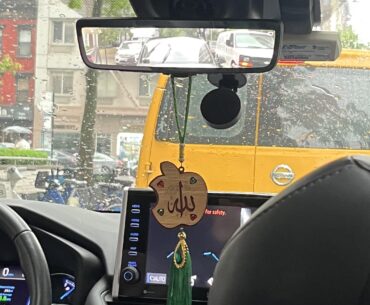 NYC taxi with megacorp iconography and digital rearview