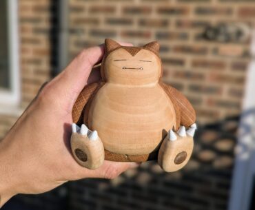 Hand carved a Snorlax out of oak, walnut, and basswood!