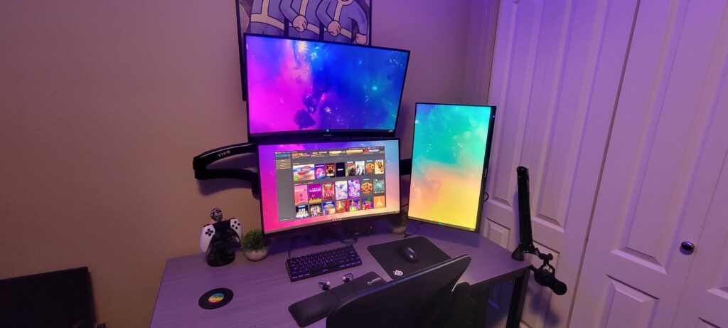 Upgraded to triple monitors and vinyl wrapped the desk.