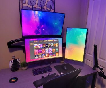 Upgraded to triple monitors and vinyl wrapped the desk.
