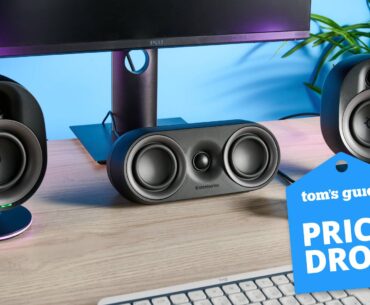 SteelSeries Arena 9 speaker setup on table with monitor and keyboard with Tom's Guide Price Drop badge