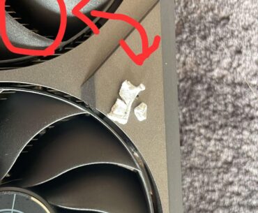 What is this that I found in my graphic card fan? Is it correlated to my pc smelling like burnt while playing?