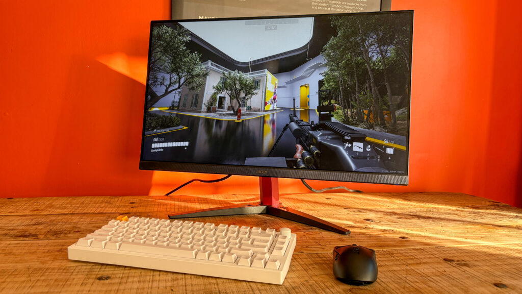 I tested this $159 gaming monitor thinking it was a joke — but it’s now my favorite budget display Acer Nitro KG272 E on table with keyboard and mouse in front with The Finals on display