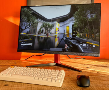 Acer Nitro KG272 E on table with keyboard and mouse in front with The Finals on display