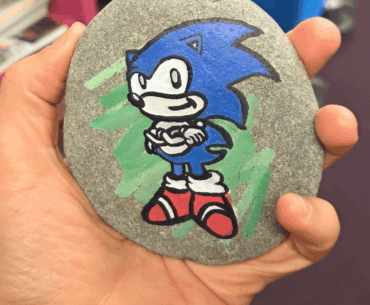My workplace is doing a community rock snake over the summer, and I thought adding a certain hedgehog would encourage people to contribute faster. :)