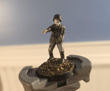 There is a game called Konflikt 47 which is a WWII table top war game with a sci fi/horror twist. In it, Germany can use zombies known as Totenkorps and I wanted to paint mine with orange eyes as an homage to CoD Zombies