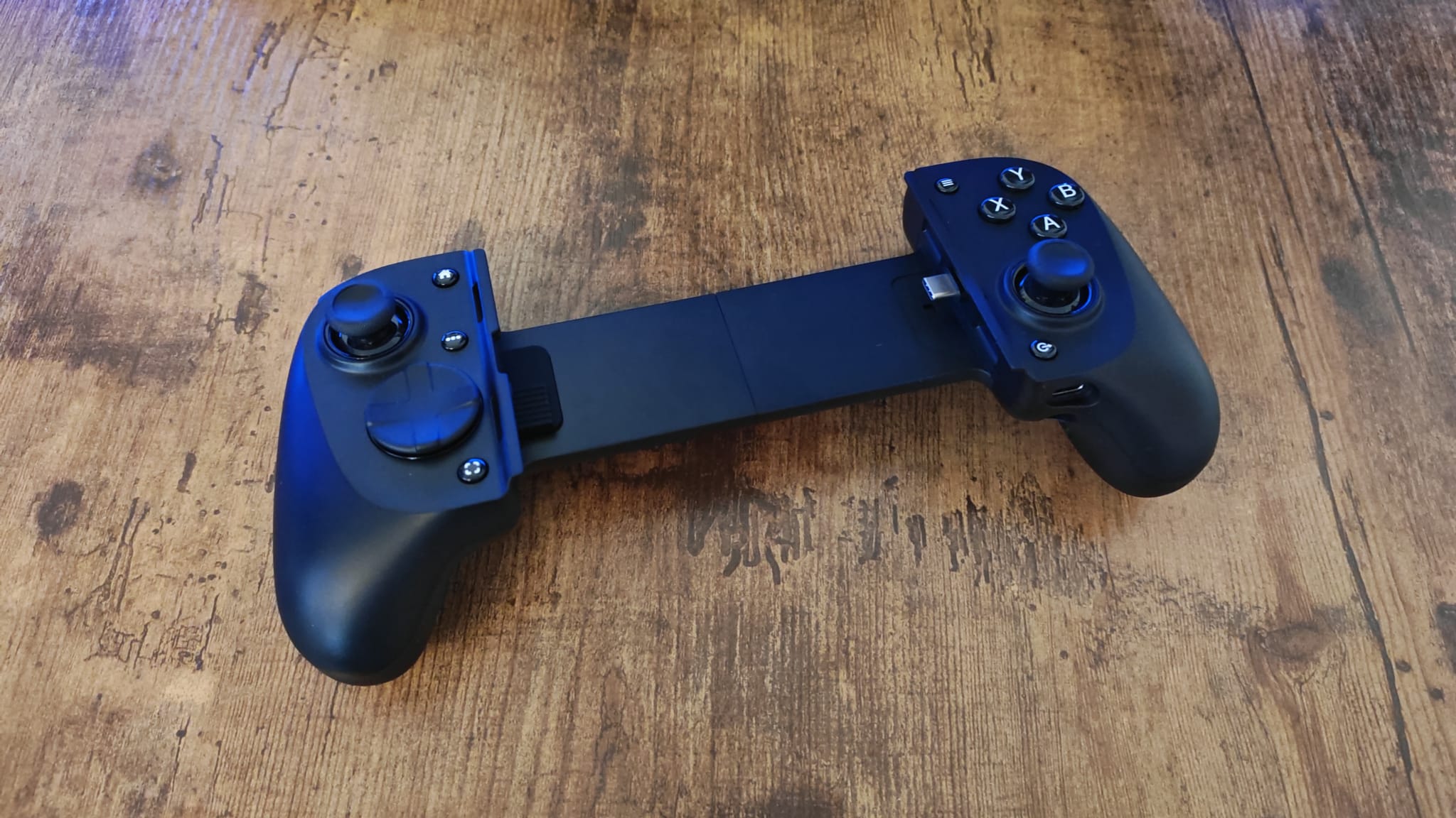 Razer launches a new range of mobile pro controllers that’s ideal for gamers with larger hands, and even larger devices The Razer Kishi V3 Pro lying on a wood desk