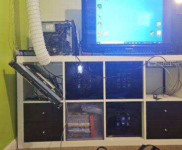 My vrchat setup - (pc on top is not part of it) HP proliant DL360 Gen6 (2009) with a 2 slot wide 1050ti shoved in a 1 wide slot , the white pipe pumps cold air in from outside and the audio is done by a car radio , the tv is a plasma screen I found in the skip of a nearby restaurant