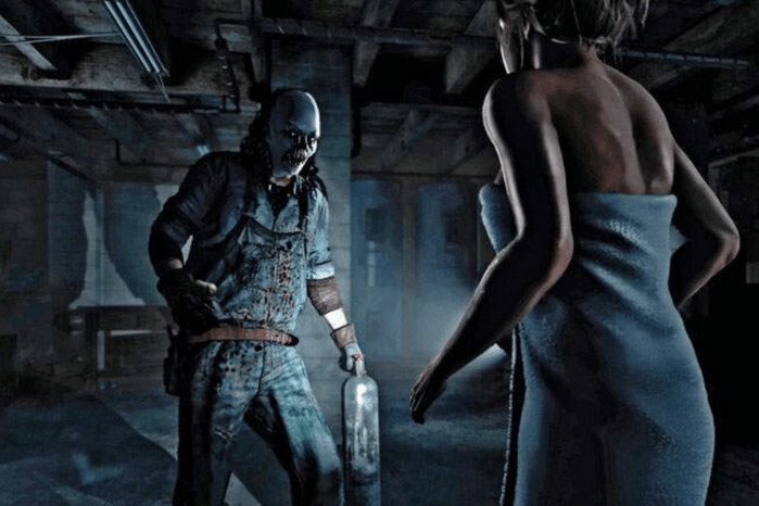 A still from the Until Dawn Game. On the right a woman in a towel is backing away towards the camera. On the left, a masked maniac in bloody overalls approaches.