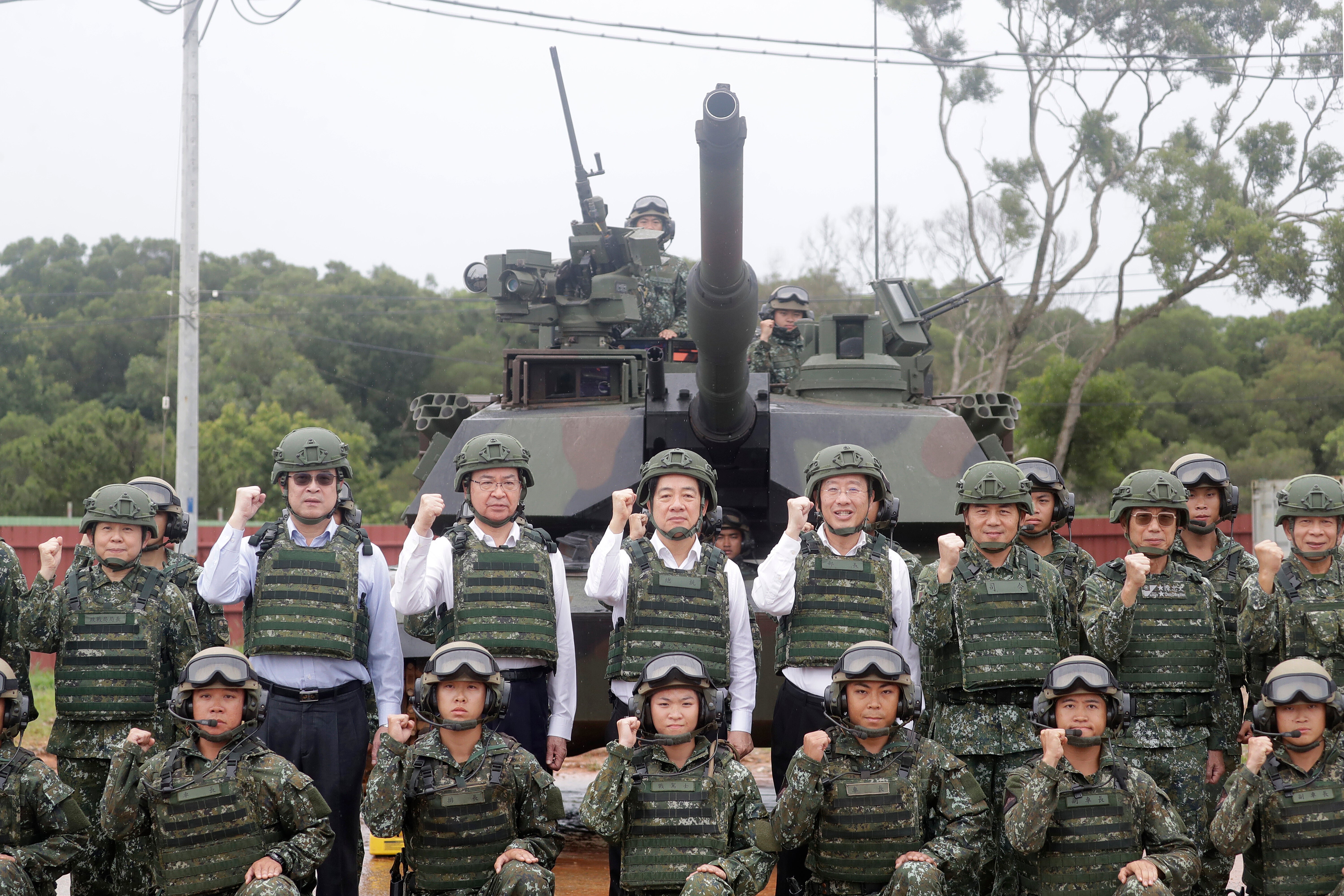 Taiwan President Lai Ching-te, center left in second row, poses with soldiers during a live-fire shooting training in Hsinchu County, Taiwan