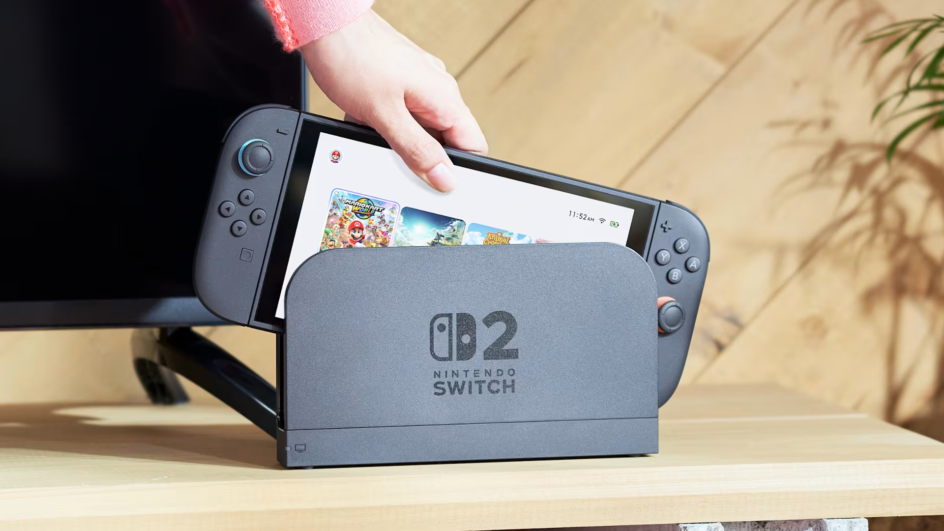 Nintendo banned a Switch 2 user for playing second-hand games and only reinstated after providing proof of purchase A Switch 2 being removed from its dock.