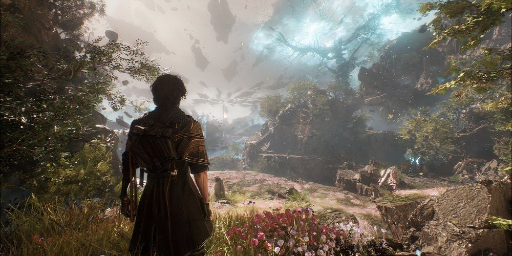 A man with his back to camera looking out on a field in the video game Clair Obscur: Expedition 33