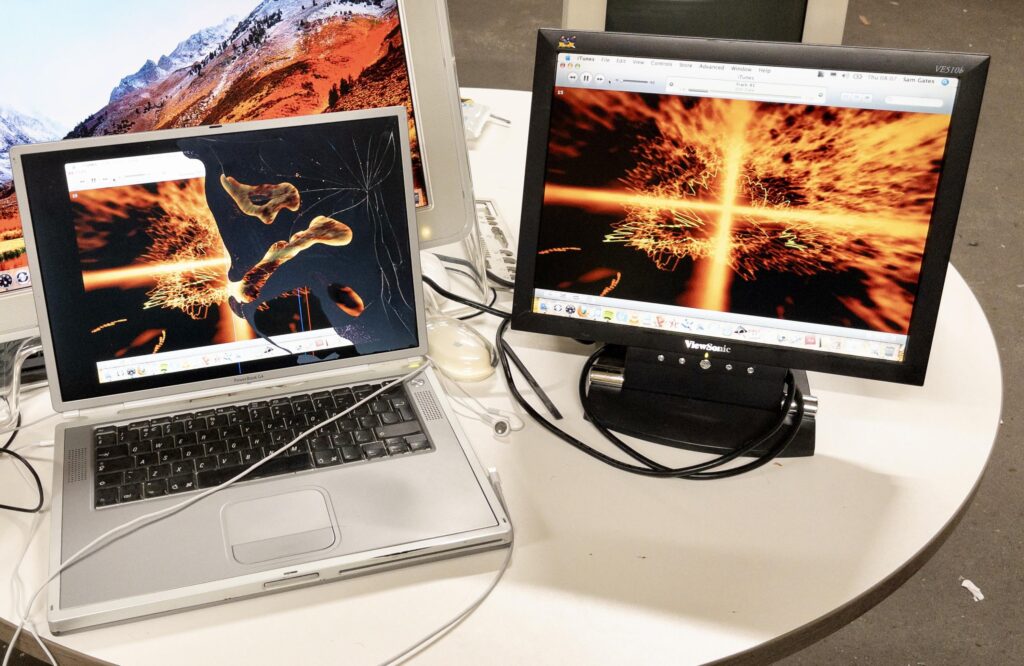 Titanium PowerBook G4 LCD screen broke so must use my View Sonic ultra wide OLED for aid.