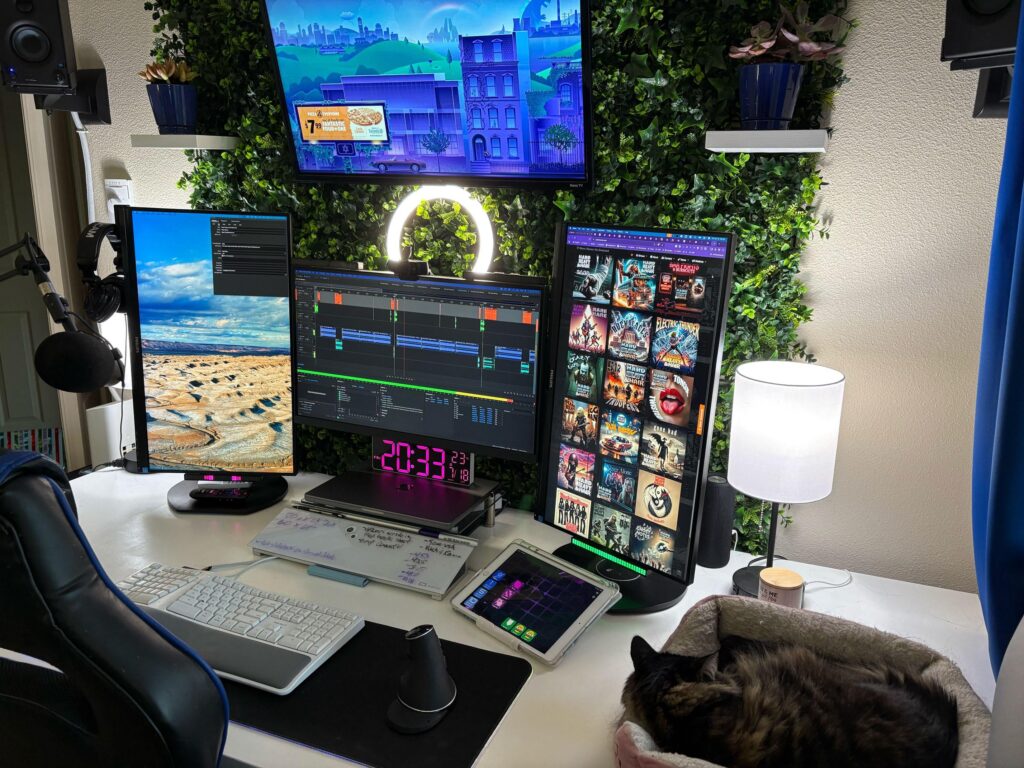 Custom-built desk and green wall online training and audio production studio