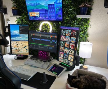 Custom-built desk and green wall online training and audio production studio
