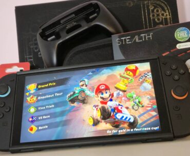 Photo by Rosalie Newcombe of the Nintendo Switch 2 sitting with a pile of accessories.