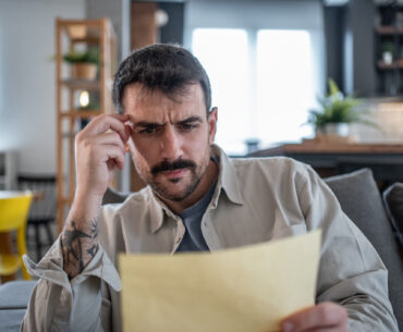 A man reads a note worried