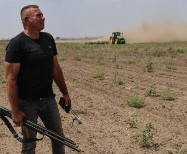 Southern Ukraine, a Man With a Drone Detector and Anti-Drone Shotgun is Protecting the Harvesting Tractors from Russian Drones