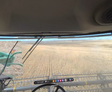 Driving a satellite driven combine while watching virtual YouTube