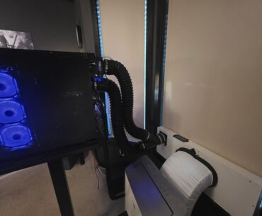My PC was turning my room into a fucking oven, so I ducted all the PC heat out the window.